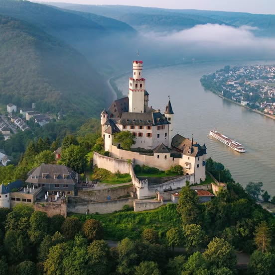 River cruise ship sailing the Rhine Gorge.